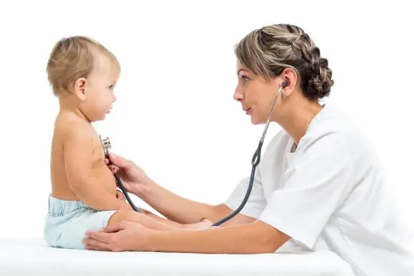 Medical Assistant Listening to Baby's Heartbeat Medical Assistant Listening to Baby's Heartbeat