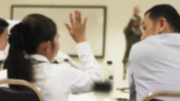 Student Raising Hand in Classroom Student Raising Hand in Classroom