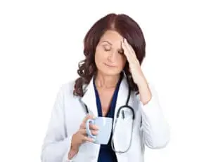 Tired Nurse Holding a Cup